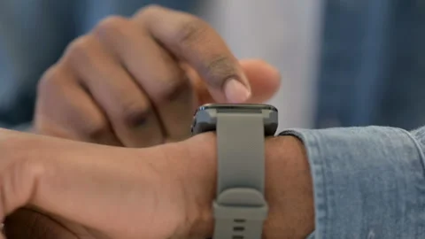 Close Up of African Male Hands Using Smartwatch Stock Footage 146478895