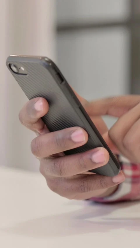 Close up of African Man using Smartphone, Vertical Video Stock Footage 340041248