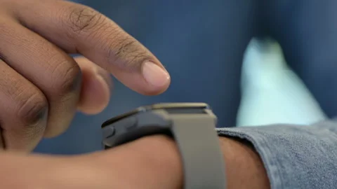 Close Up of African Man Using Smartwatch Stock Footage 146478770