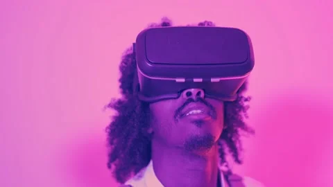 Close up of an african man using virtual reality goggles Stock Footage 239220200
