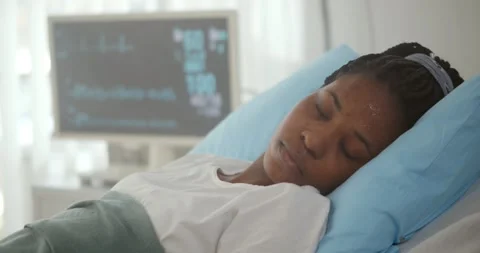 Close up of afro-american patient lying in hospital bed and losing consciousness Stock Footage 150625053