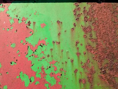 Close up of aged distressed chipped rusted paint work on a wall in green an.. Stock-Fotos