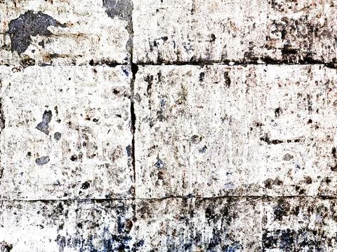 Close-up of aged grunge texture of light stonework with cracks and abrasions. Stock Photos