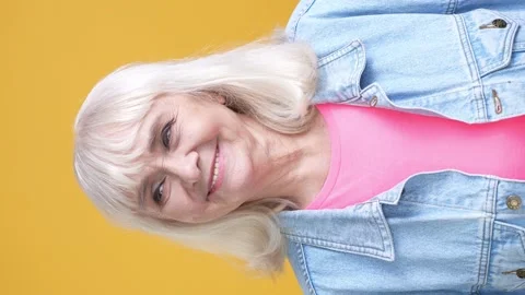 Close up aged lady smiling enjoy look isolated bright color background Stock Footage 189924670