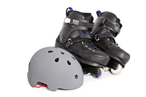 Close up of aggressive inline skates and a helmet Stock Photos