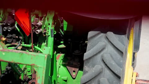 Close up of a agricultural tractor showing the large rear tire, hydraulic Stock Footage 340448426
