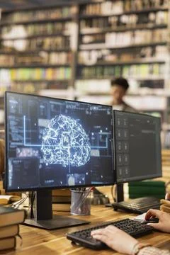 Close up of AI brain visualization running on monitor in library computer class Stock Photos
