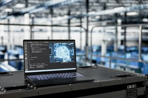 Close up of AI code running on laptop managing server room rigs Stock Photos
