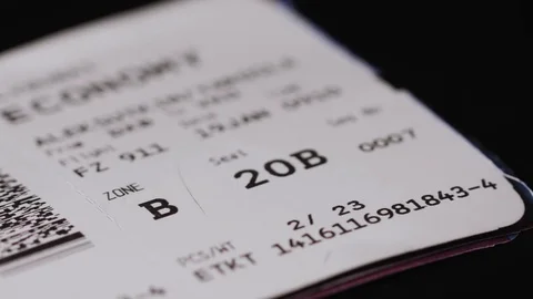 Close up of air boarding passes with baggage tag isolated on black background Video stock 73670722