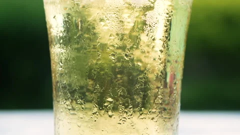 Close-up of air bubble while pouring mineral carbonated water into a clear glass Stock Footage 134505585