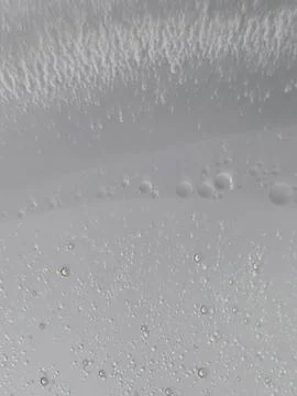 Close up of air bubbles in clear liquid with abstract pattern Stock Photos