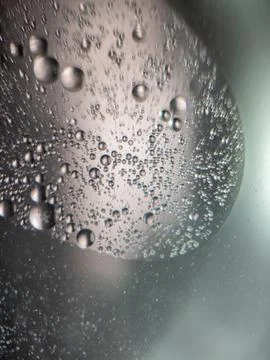 Close up of air bubbles in liquid with abstract light effect Stock Photos