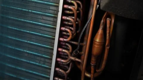 Close-up of air conditioner or refrigerator cooling parts with copper pipes.. 動画素材 338319426