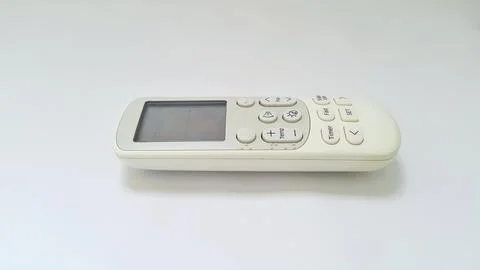 Close up of air conditioner remote control with display on white background Stock Photos