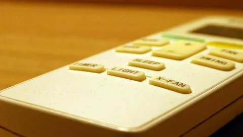 Close up of the air conditioner remote on the table Stock Photos