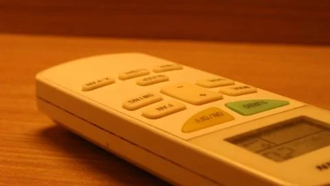 Close up of the air conditioner remote on the table Stock Photos