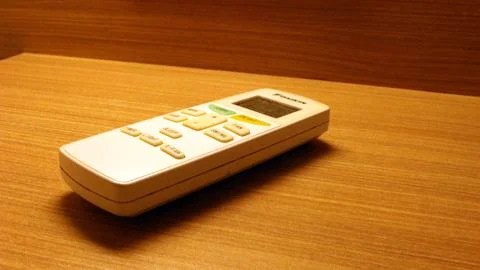 Close up of the air conditioner remote on the table Stock Photos