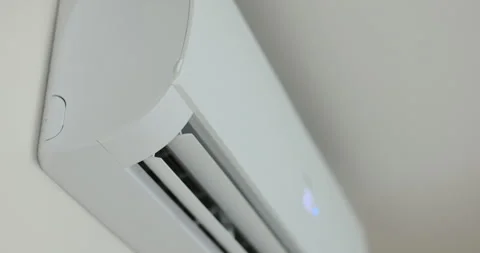 Close up of a air conditioner turning on and opening its air outlet. Modern air Stock Footage 278533909