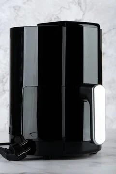 A close-up of the air grill on the kitchen table. Stock Photos