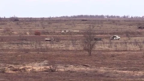 Close Air Support Training with plane firing at vehicles Stock Footage 83645897