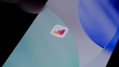Close-up of the Airalo app being deleted from a smartphone home screen in a Stock Footage 337239999