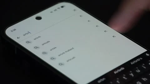 Close up of Airbnb application download on smartphone screen Stock Footage 340053660