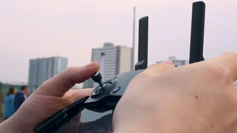 Close-up of an aircraft control panel. The drone control joystick holds a man in Stock-Footage 154967406