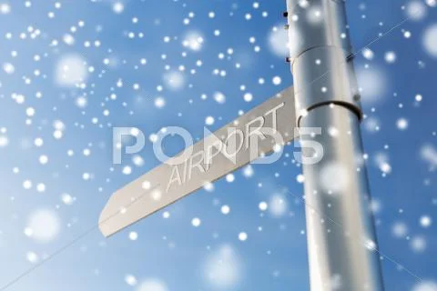 Close up of airport signpost over blue sky Stock Photos