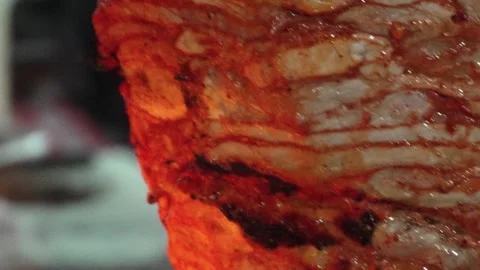 Close up al pastor sizzling as it get cooked  Stock Footage 295844200