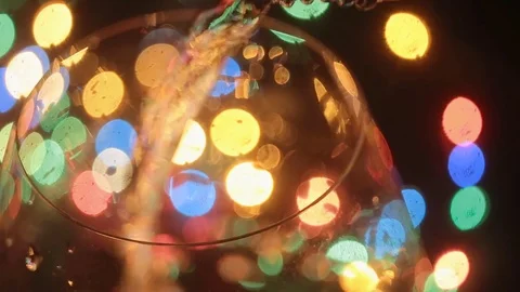 Close up of alcoholic drink pouring into empty glass on a bar or night club Video stock 74414704
