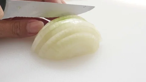 Close-up Allium cepa vegetable cutting in the kitchen Stock Footage 70198800