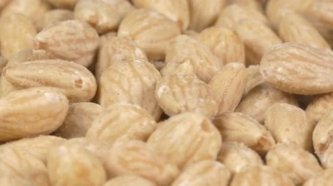 Close-up of almonds on a rotating plate Stock Footage 60189024