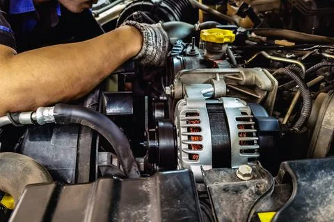 Close up to alternator or electrical generator under the hood of pick up ca.. Stock Photos