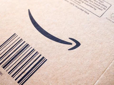 A close-up of an Amazon delivery package with a smile logo symbol. Stock Photos