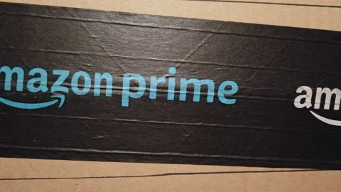 Close-up of the Amazon Prime package, Amazon PRIME logo printed on safety ca Stock Footage 172446544