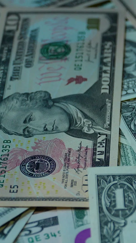 Close Up Of American Dollar Banknotes Scattered On Table Stock Footage 339971767