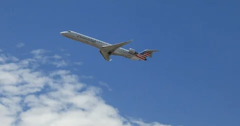 Close up on an American Eagle Airplane Flying Stock Footage 98668846