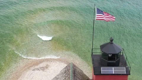Close up of American Flag on top of Lighthouse at Mackinac Island Stock Footage 246930575