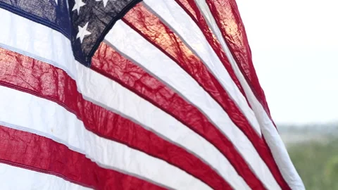 Close up American flag waving on sunset with soft focus, Slow Motion. Stock Footage 142750722
