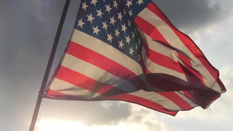Close up American flag waving in the wind against sunset with slow motion. Stock Footage 311852881
