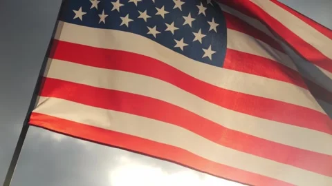 Close up American flag waving in the wind against sunset with slow motion. Stock Footage 311913256
