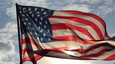 Close up American flag waving in the wind against sunset with slow motion. Stock Footage 311913258