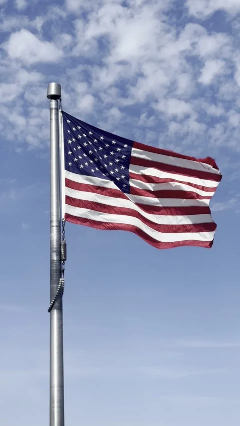 Close‑Up American Flag Waving in the Wind - Vertical Video Stock-Footage 332382570