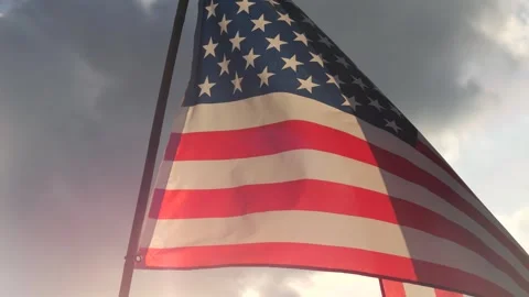 Close up American flag waving in the wind against sunset with slow motion Video stock 336979095