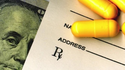 Close-up of American one hundred dollar bill, prescription and pills. Stock Footage 80010645