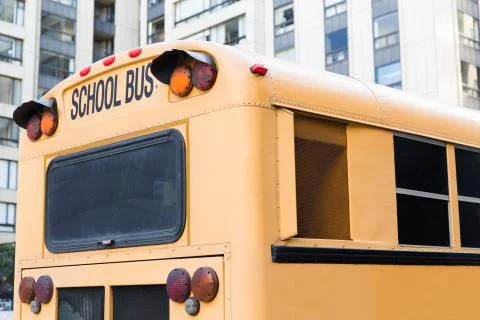 Close up of american schoolbus on city street Stock Photos