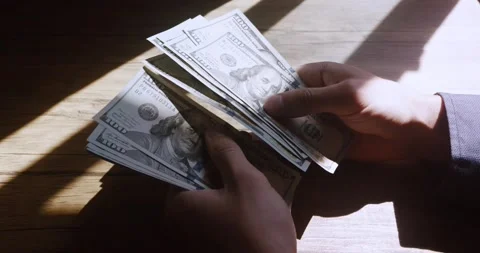Close-up of American US dollars in hands, counting money. Business person Stock Footage 231195964