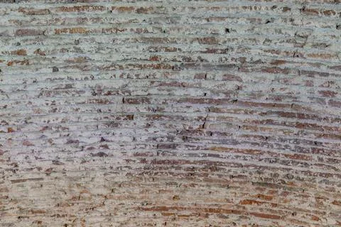 Close-up of an ancient arched ceiling with rough, textured brick and mortar. Stock Photos