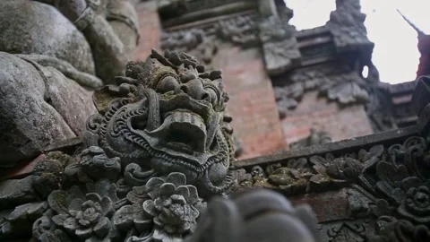 Close Up of Ancient Balinese Stone Demon Carving at Temple Entrance Stock Footage 345220064