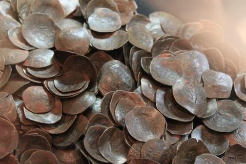 Close up of ancient coins with reflected light Stock Photos